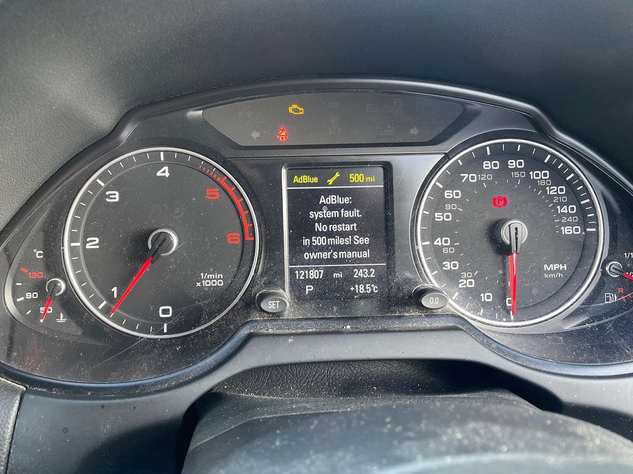 AUDI system error displayed on a car Dashboard