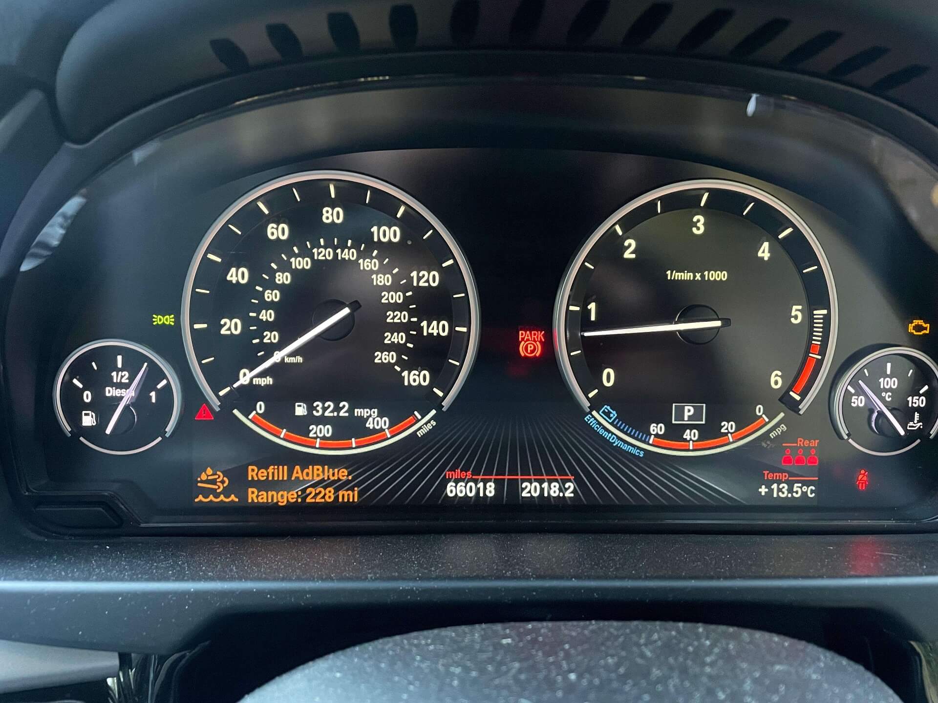 Diesel exhaust fluid Refill warning light displayed on BMW Dashboard
