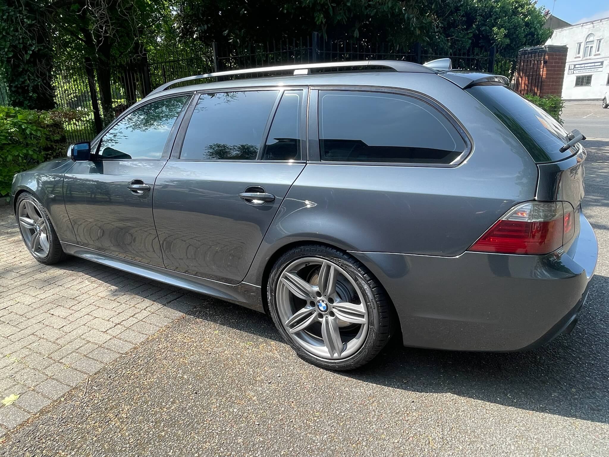 Grey estate BMW with tinted windows